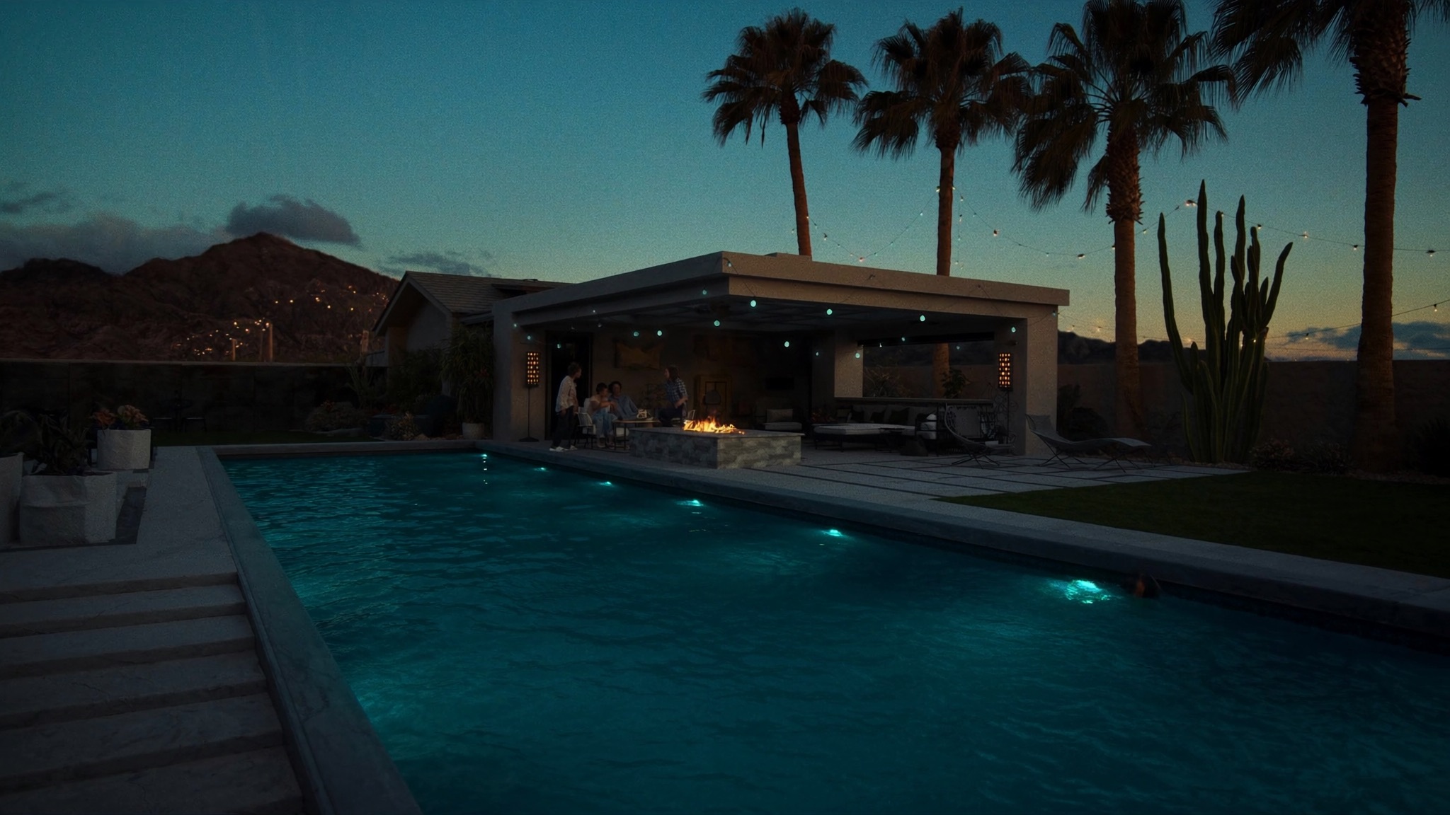 Luxury Phoenix backyard with pool and patio at dusk